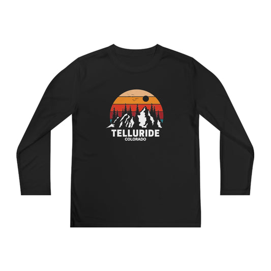 Black kids long-sleeve shirt with the words "Telluride Colorado" in white lettering and a picture of the mountains with a colorful sunset in the background. The shirt is a stylish and comfortable way to show your love of skiing, hiking or snowboarding at the Telluride Ski Resort.