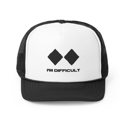 Black trucker hat with white label and black lettering saying "I'm Difficult" and two double diamond ski signs. It is perfect for keeping the sun out of your face while you're skiing or snowboarding.  The two double diamond ski signs are a reference to the most challenging ski runs at Telluride Ski Resort, making this hat a great way to show your support for the resort and the snowboard and ski lifestyle.