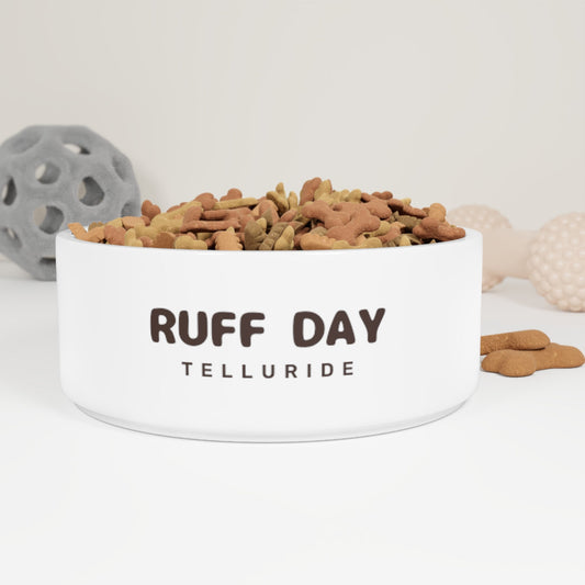 White ceramic dog bowl with brown lettering saying "Ruff Day" and Telluride. The bowl is perfect for feeding your furry friend after a long day of playing in the snow. The bowl is a great way to show your love for your dog and your love of skiing and snowboarding at the Telluride Ski Resort!