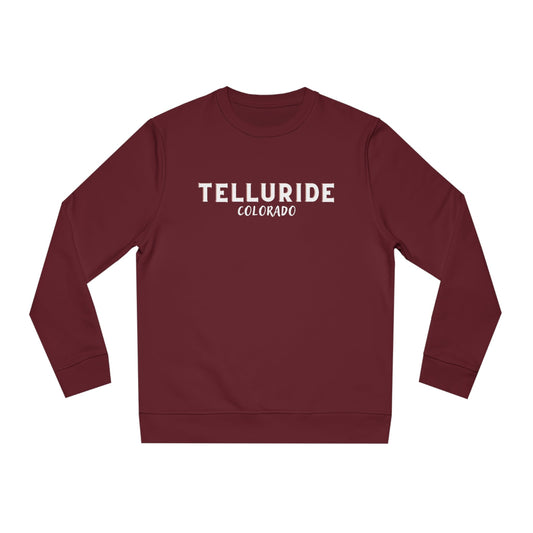 Red sweatshirt with white lettering saying "Telluride Colorado". The sweatshirt is a stylish and comfortable way to show your love of skiing, snowboarding, hiking or shopping at the Telluride Ski Resort. 