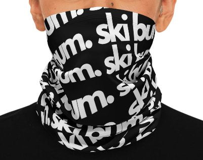 Winter neck gaiter with the words "Ski Bum" printed in white on a black background. The neck gaiter is a stylish and practical way to keep your neck warm and protected from the elements while celebrating your love of skiing and the Telluride Ski Resort. The neck gaiter is a great way to show your love of Telluride and Colorado, whether you're a ski bum or not.