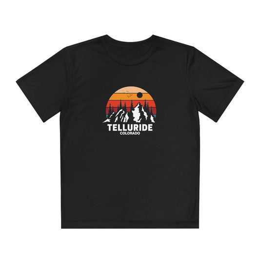Black kids short-sleeve t-shirt with the words "Telluride Colorado" in white lettering and a picture of the mountains with a colorful sunset in the background. The tee is a stylish and comfortable way to show your love of skiing, hiking or snowboarding at the Telluride Ski Resort. 